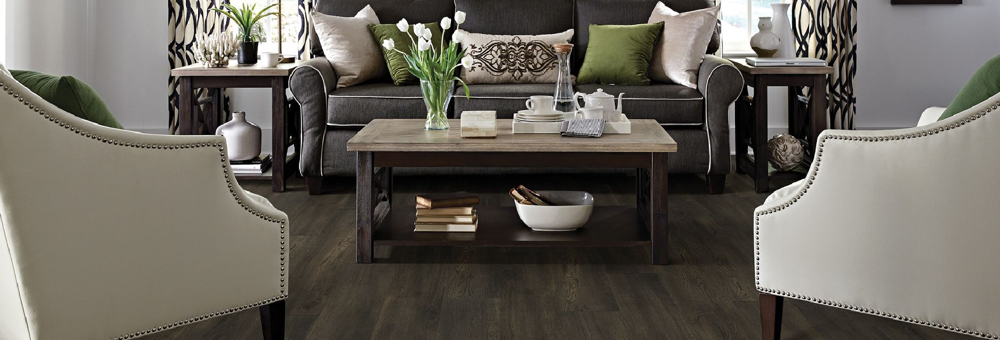 living room with cream chairs and coffee table on laminate floor